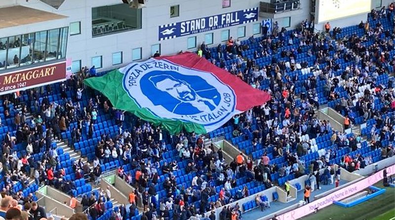 The Roberto De Zerbi flag is passed over the North Stand before Brighton 0-1 Spurs at the Amex