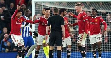 Manchester United players surround referee Mr Bankes to demand Lewis Dunk is sent off during their 2-0 win over Brighton