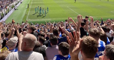 Brighton fans celebrate their 1-0 win at Spurs in April 2022