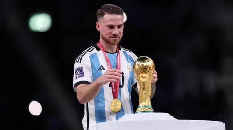 Brighton midfielder Alexis Mac Allister with the World Cup trophy
